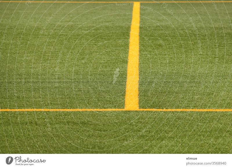 Partial view of a green football turf with yellow lines Lawn Line Yellow demarcation Playing field Geometry division Football pitch Sporting grounds Ball sports