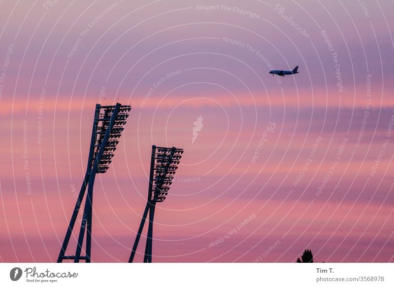 Approach Berlin Roof chestnut avenue Architecture Sky Clouds Airplane Town Deserted Evening Stadium Twilight Sunset Silhouette Exterior shot Transport