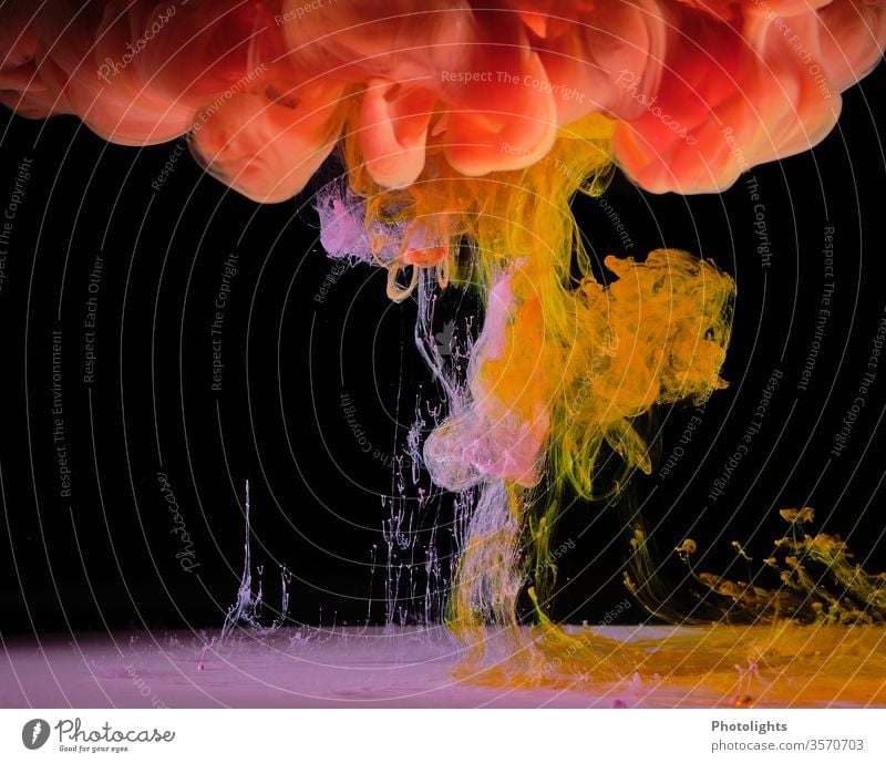 Water feature with yellow, pink and orange colour on black background Yellow Black Play of colours Background picture Art Structures and shapes Colour photo