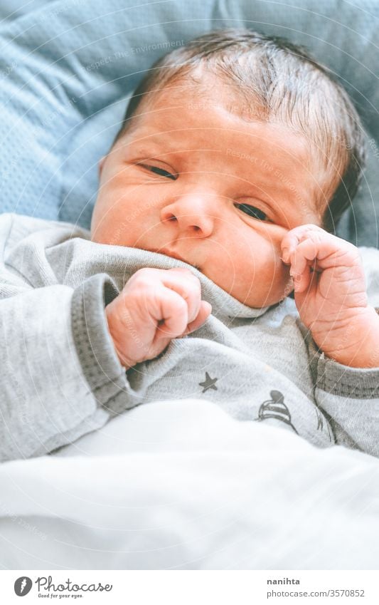 Little new born girl lying down and trying to relax baby birth first day boy mom familly happy happiness care love child daughter son tired sleep sleeping dream