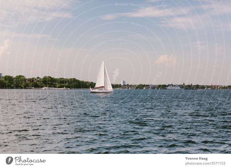 Sailing tour on the sea Sand Beach Ocean Water Waves Surf Coast Sky Blue Clouds Horizon Nature Far-off places Landscape White Beautiful weather Summer Day