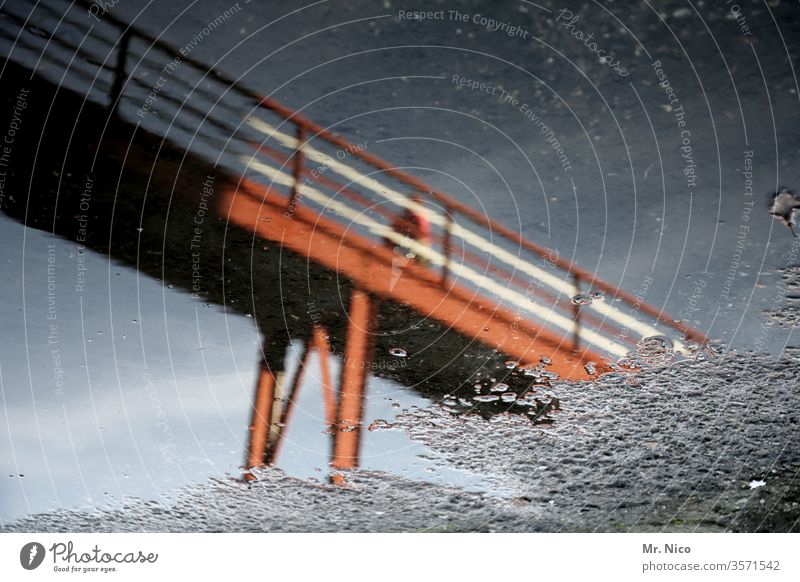 pedestrian bridge Pedestrian bridge Pedestrian crossing Going Lanes & trails Puddle puddle mirroring Asphalt Reflection Wet Town Water Shadow Tar rainy season