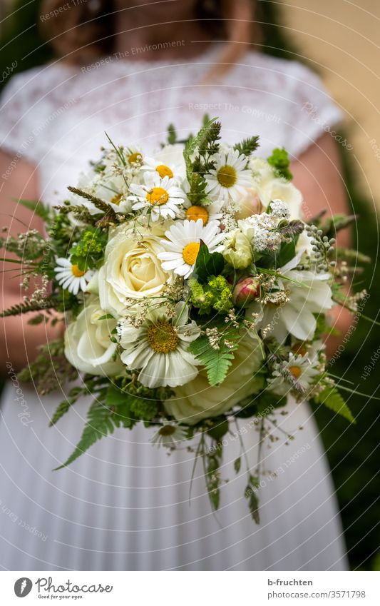 Bride holding bridal bouquet Wedding Love Bouquet Colour photo Exterior shot already Romance Feasts & Celebrations White Woman Happiness Adults flowers Elegant