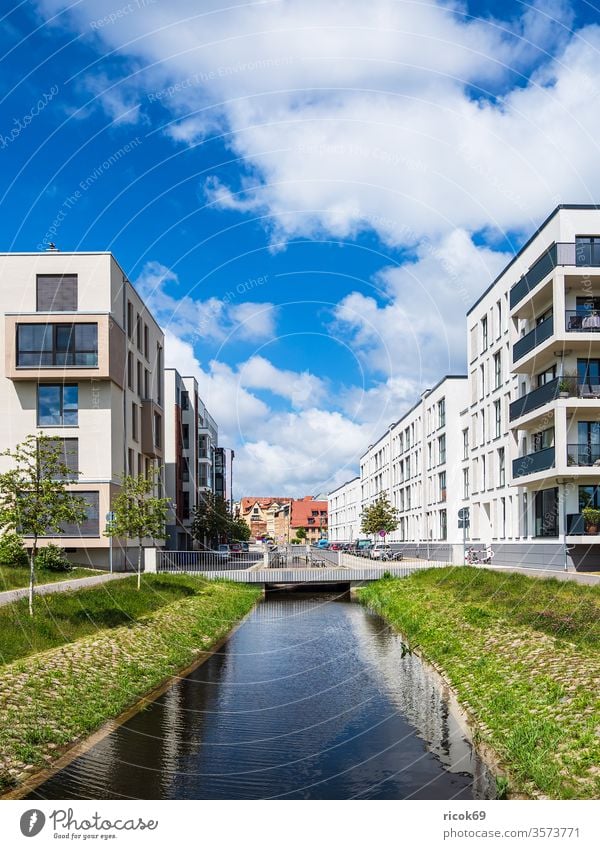 Modern buildings and canal in the Hanseatic City of Rostock Historic House (Residential Structure) built Channel Petriquette bridge Town