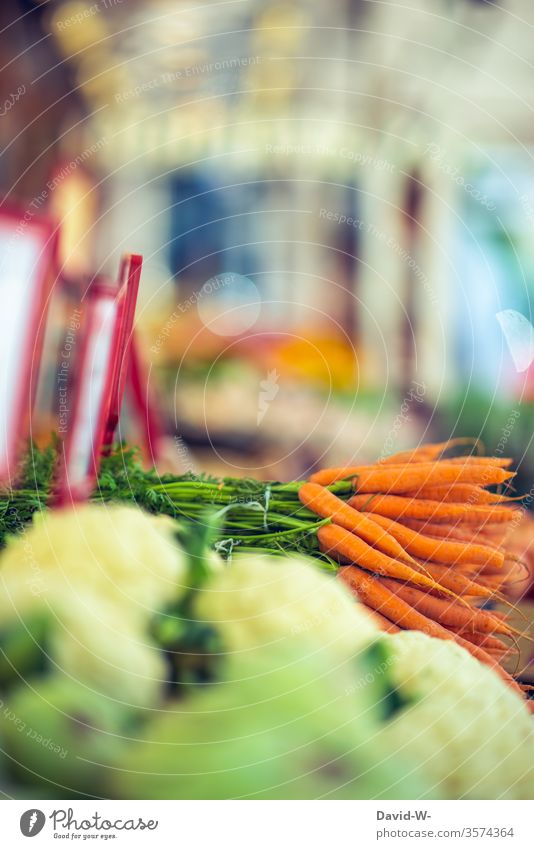 Fresh vegetables at a weekly market Farmer's market Vegetable carrots Markets Market day stand Market stall Delicious Vegetarian diet Healthy Eating