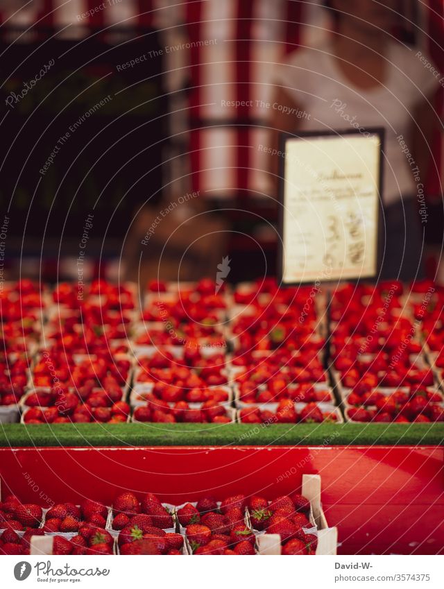 Weekly market - strawberry stall with saleswoman in the background Marketplace Farmer's market Vegetable fruit Market stall Sustainability salubriously