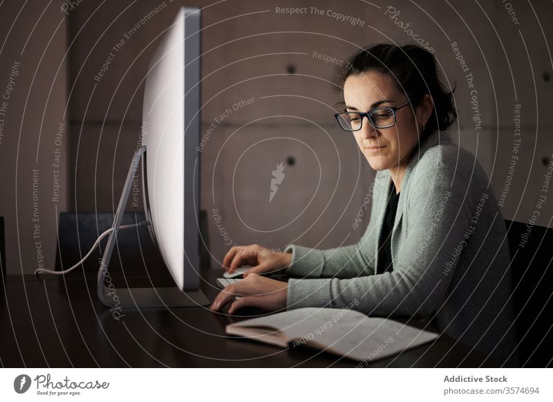 Focused woman working with gadgets at home smartphone computer telework using browsing young casual female serious concentrate focus blank screen empty screen