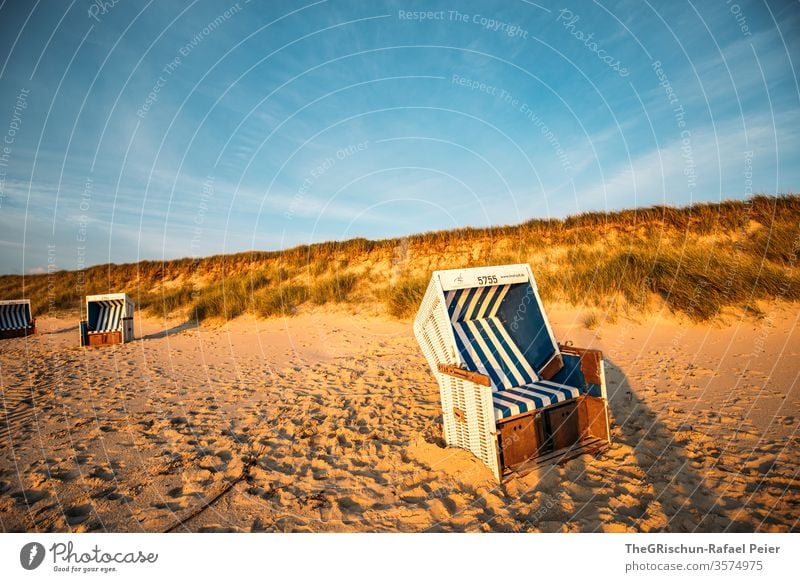 Strandkorb on the beach with dune in the background Sylt Beach vacation Sand Vacation & Travel Beautiful weather North Sea Summer Ocean Water Sky Blue Deserted