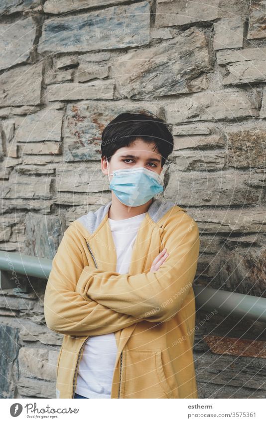 sad and angry kid wearing medical mask coronavirus child epidemic pandemic thoughtful quarantine covid-19 symptom medicine health death protect childhood