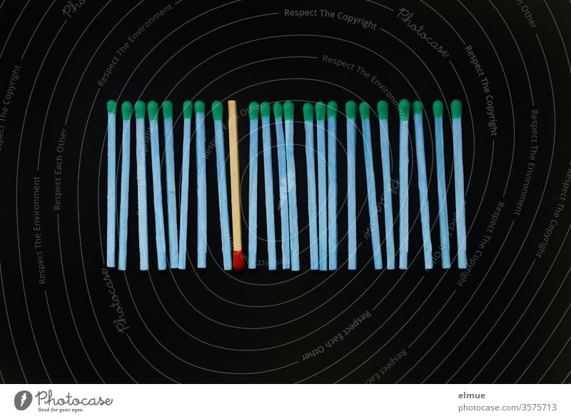 Photochallenge I a row of blue matches with green heads and a natural match with red head on black background Match match head sorted Individualist be different