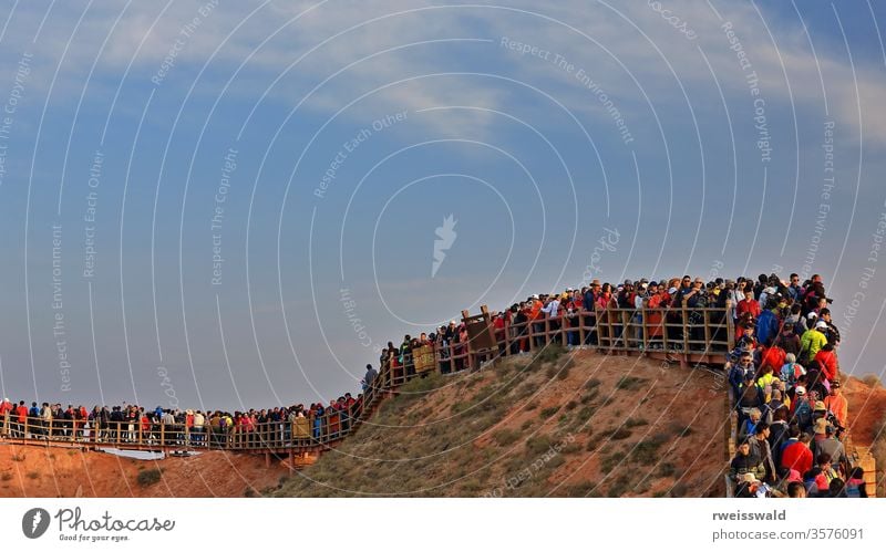 Peak hour on Colorful-Clouds Observation Deck. Zhangye Danxia-Qicai Scenic Spot-Gansu-China-0906 many people woman boy girl tourist visitor wood wooden fence