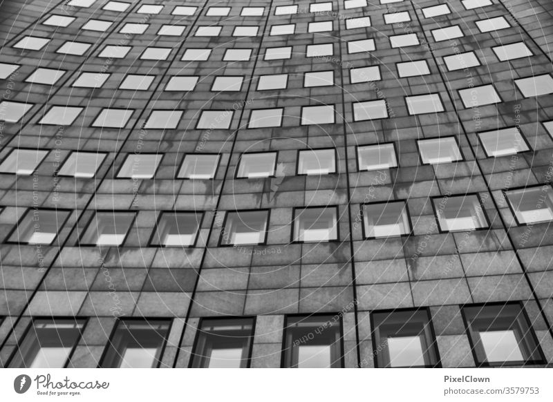 High-rise front with many windows Architecture Town Skyline built Manmade structures Tall Deserted black and white Facade Gray