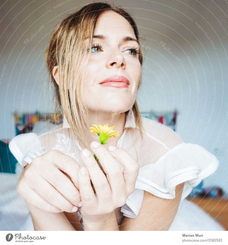 bride on her wedding day suggesting a flower love getmarry girl beauty