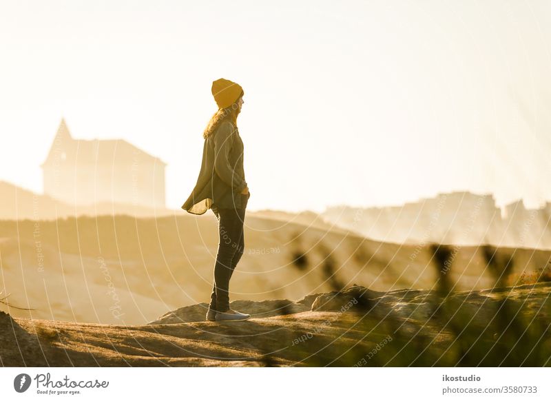 Woman enjoying the view woman beach travel adventure traveler walking lifestyle vacation hike hiking person nature sea female activity one ocean blue girl