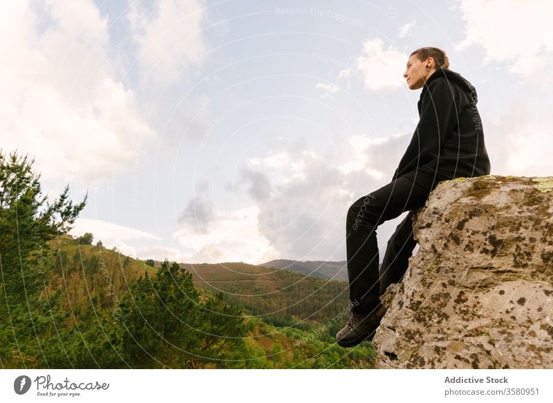 Traveling woman admiring mountainous landscape trekking hiker travel backpack highland magnificent scenery female hoces del esva valdes asturias spain rock