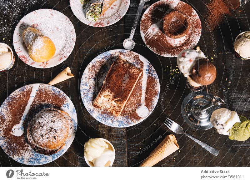 Set of various tasty desserts on table delicious sweet pastry tiramisu chocolate cake muffin set cocoa sugar powder serve confectionery yummy baked treat