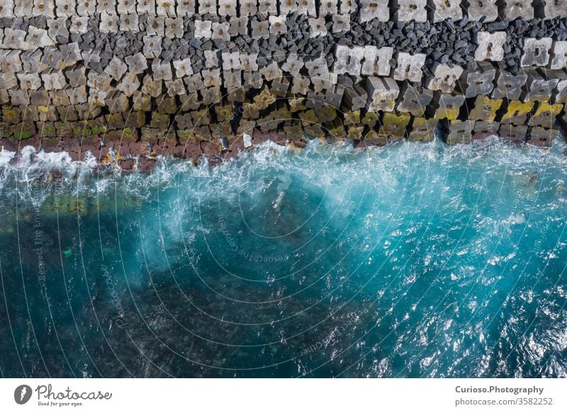 Aerial view to ocean waves. Blue water background. Photo made from above by drone. sea top beach aerial nature blue texture abstract travel summer coast