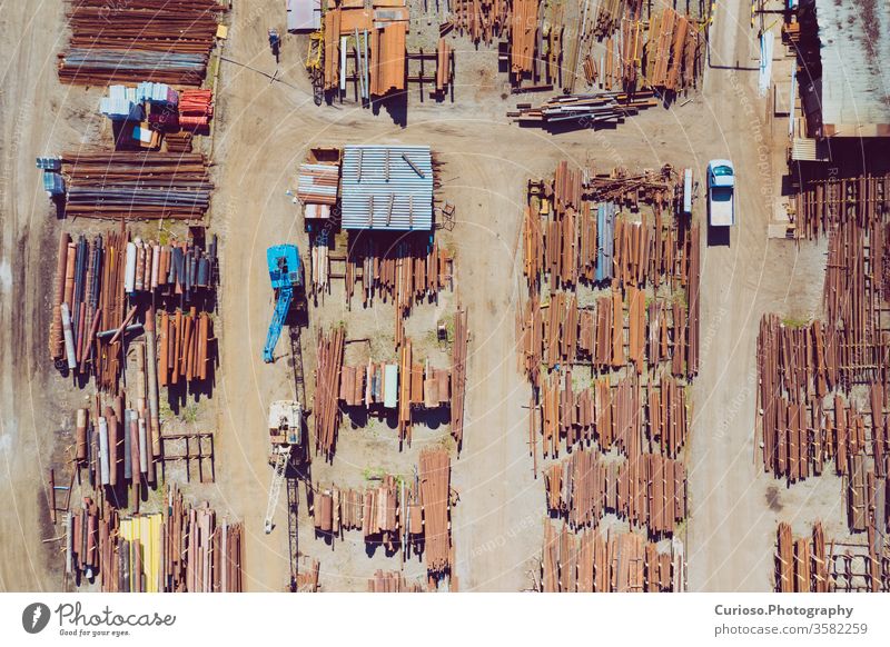 Aerial top view of steel stogare industrial place. Photo made by drone from above. storage industry construction metal warehouse iron factory pipe bar logistics