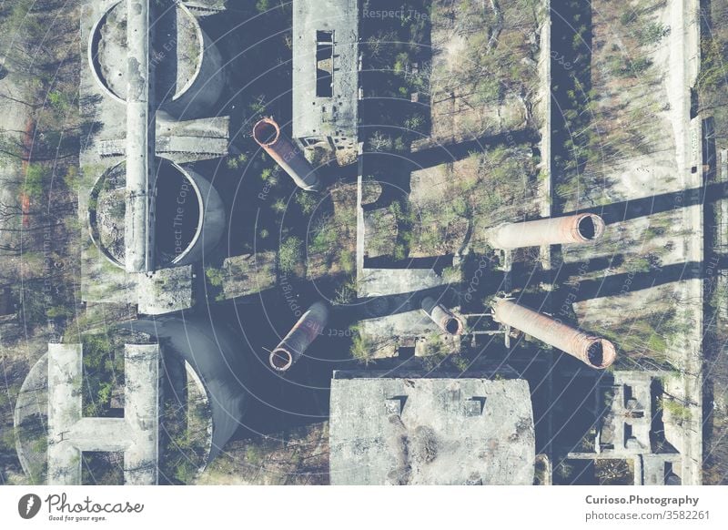 Aerial top view of abandoned industrial place. Photo made by drone from above. factory building old warehouse background interior industry dark grunge urban