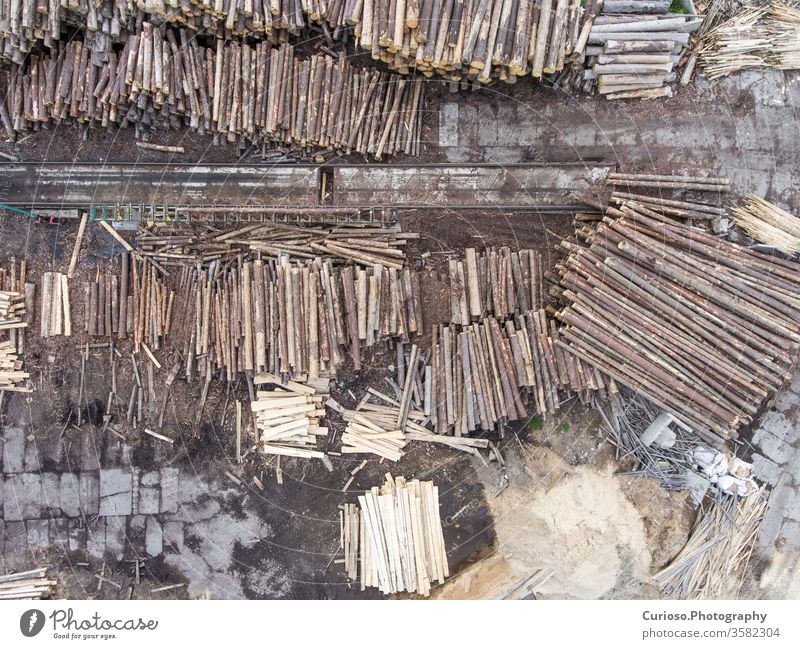 Sawmill. Felled trees, logs stacked in a pile. View from above. Industrial background. bird carpentry construction copter crane cut deforestation drone