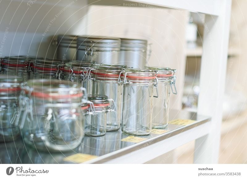 empty preserving jars on a shelf Glass rubber ring Wired ironed glass Empty Shopping without plastic unpacked Shelves Load shank Food ecologic sustainability