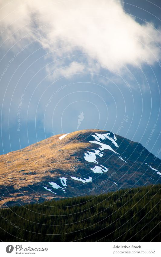 Mountain peak with snow under cloudy sky mountain hill slope landscape spring nature highland scotland glen coe scenic environment range travel tourism ridge