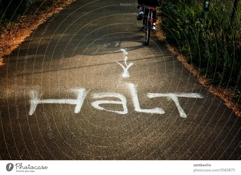 STOP Cycle path cycle path cyclist cyclists Bicycle Wheel Deserted Copy Space sprayer writing Sign waypoint Road marking tip navi Navigation Arrow Right