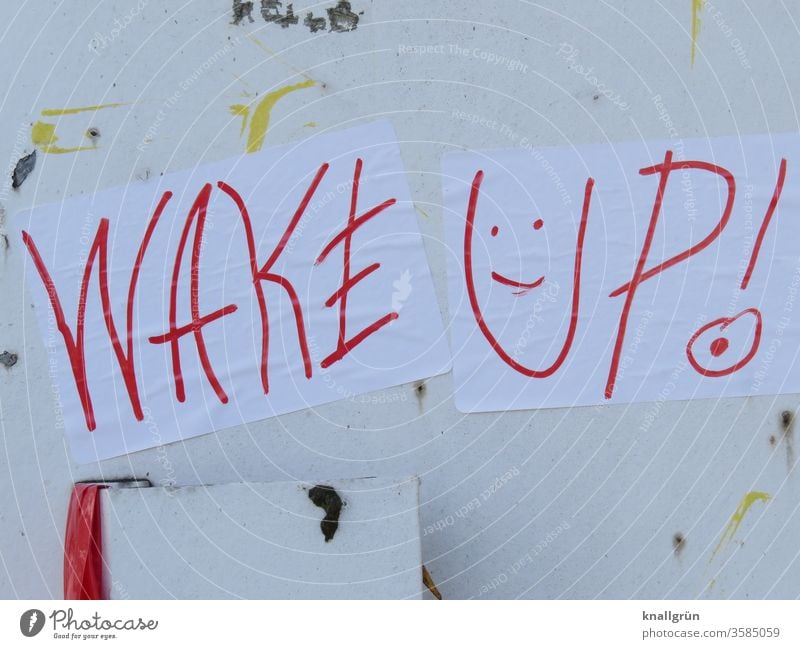 Two white sheets of paper "WAKE UP!" with a smiley face written with a red pen stick to an old white metal door Smiley Graffiti Wake up wake up Exclamation mark