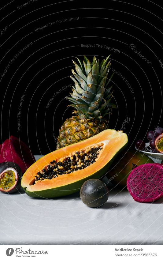 Still life with tropical fruits exotic papaya hawaii ingredients natural organic food pitaya dragon passion green colorful juicy sweet ripe vegetarian