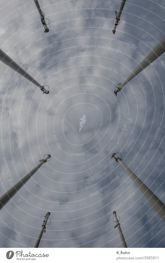 View upwards Sky Blue Clouds Metal forces White Steel Line Town Tall Wind Flag Windmill Environment symbol Pole National International world state Europe banner