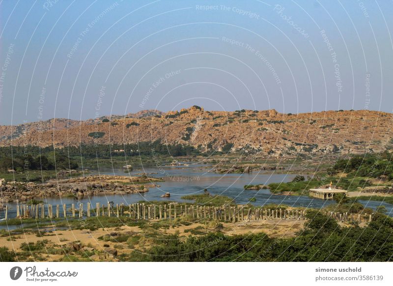 view of rocks and river water landscape trees