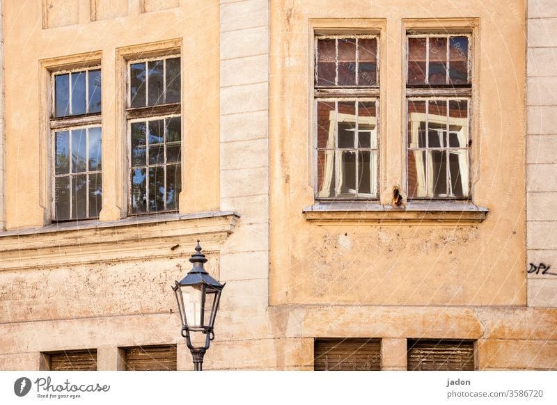 windows to the street, exterior lighting. Facade Architecture House (Residential Structure) Window built Wall (building) Deserted Town Exterior shot