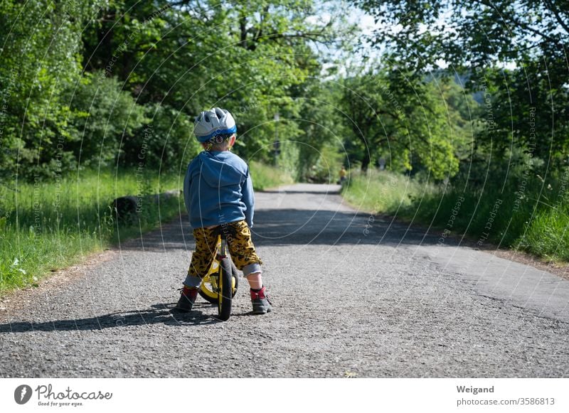 Child with bicycle on a path Lanes & trails Bicycle impeller wax Infancy Study Transport Exterior shot Cycling Day Street Colour photo Driving