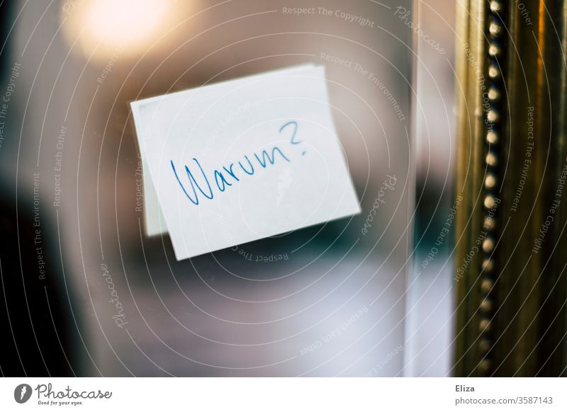 Post-it on the mirror where it says "Why? Ask about the meaning of life or something. why? question post-it note on liability Emotions inner turmoil Pain