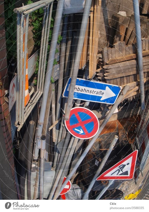 Signpost fallow Traffic signs One-way street Construction site Clearway landfill poles Colour photo Exterior shot Signs and labeling Transport Road sign Signage