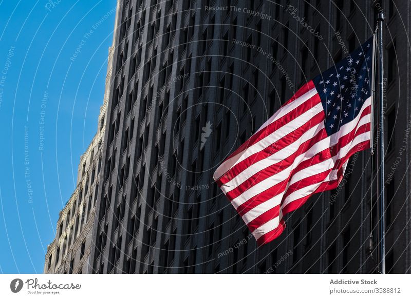 American flag on street in New York City american flag national stone building patriot symbol urban facade new york usa united states city sign hang culture