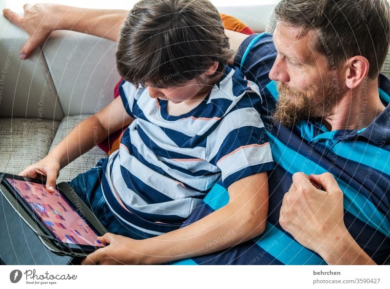 we can't always just read. laptop Computer stay at home Family Colour photo Interior shot Close-up Child Boy (child) Infancy Day Light Contrast portrait