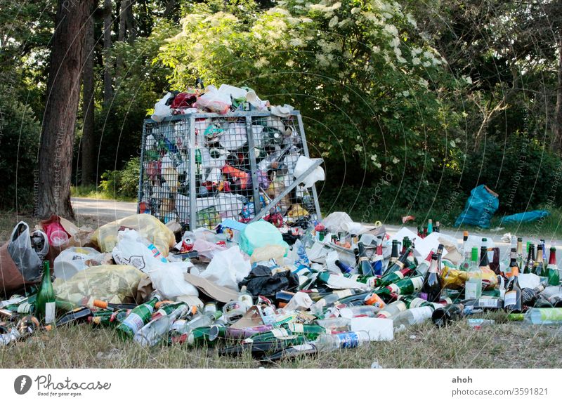 Garbage mountain in the park Trash mountain of rubbish waste Green spaces Waste management Indifference waste disposal public space waste separation Shackled