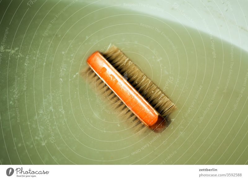 Hand washing brush in water bursts hand brush hygiene Wash Sanitary washroom Sink washing up water Bristles float be afloat Brackish water Dreary Copy Space