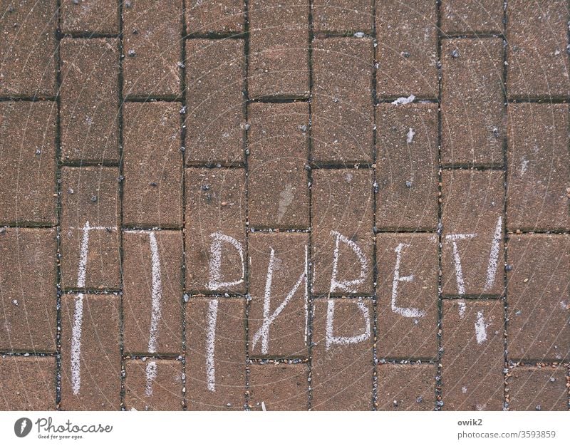 Tourism Under Sidewalk Characters Russian Unfamiliar Foreign language Salutation Hello Colour photo Copy Space top Neutral Background Deserted Exterior shot