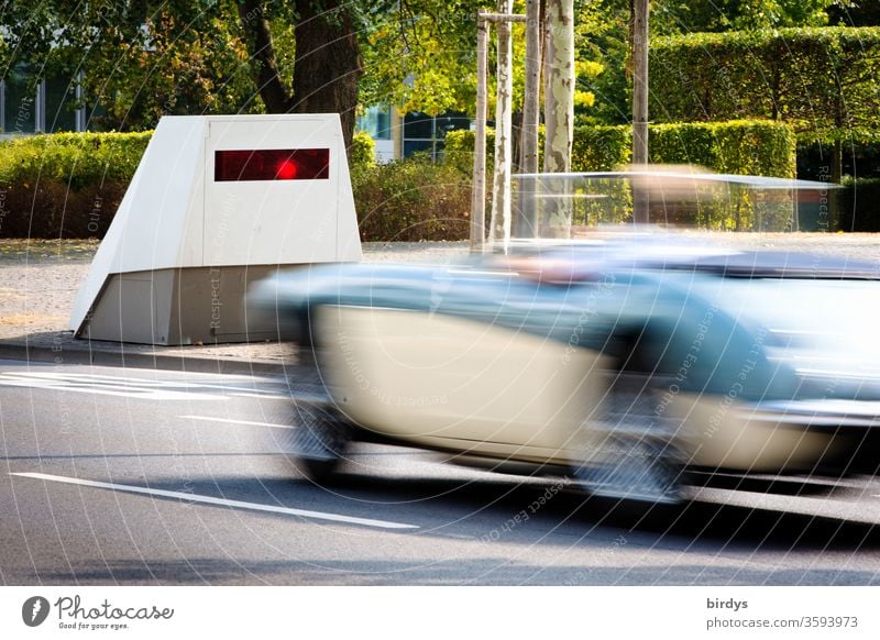 Radar control, modern, mobile radar unit for speed measurement, enforcement trailer. Infrared flash triggers when a convertible driver exceeds the speed limit.