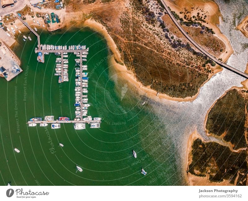 Aerial view of marina and broadwalk in Alvor, Algarve, Portugal broad walk alvor algarve nature portugal seaside seascape bay aerial landscape aerial view