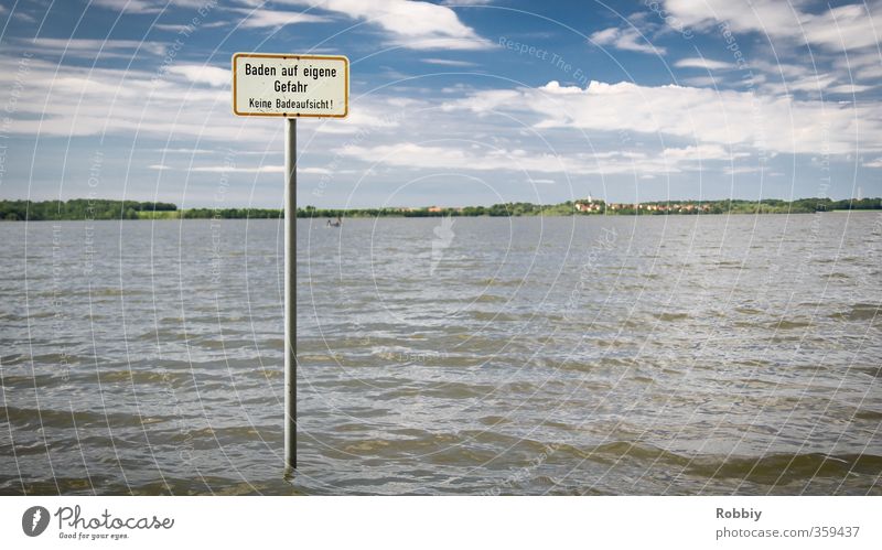 Bathing at your own risk Swimming & Bathing Beach Ocean Waves Aquatics Nature Landscape Water Coast Lakeside Pond Signs and labeling Signage Warning sign Blue