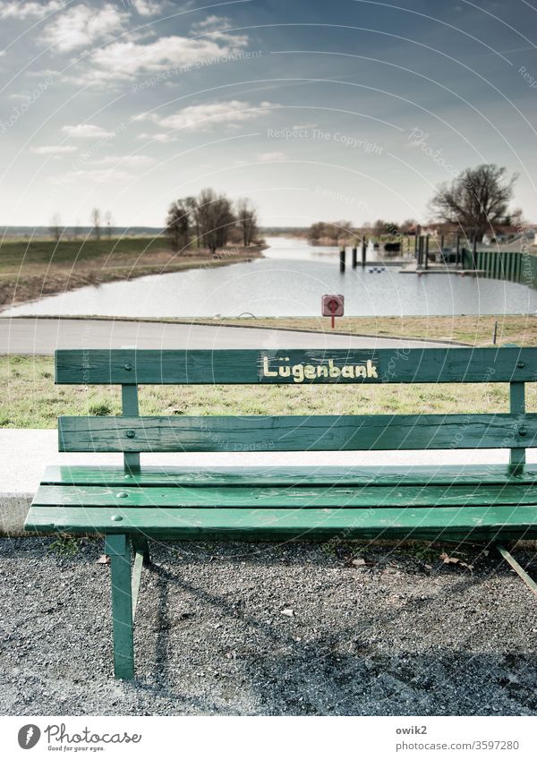 Bath bench Bench Inscription Lettering Bank of lies Characters Typography Signs and labeling Exterior shot Detail Deserted Letters (alphabet) Word Clue Warn