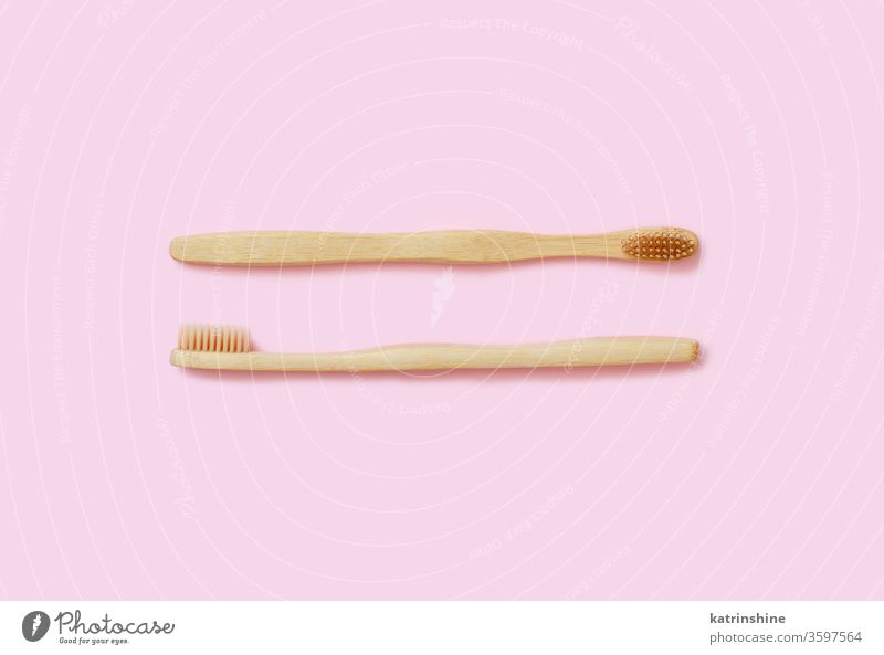 Eco friendly bamboo toothbrushes on pink background waste concept light pink top view zero waste tooth brushes health alternative cleaning above dental