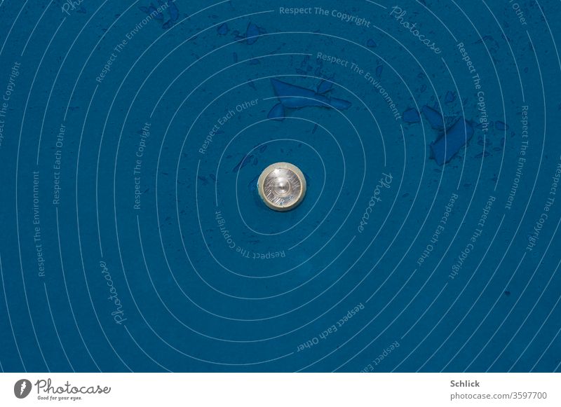 Door viewer in blue door with delaminating lacquer Peephole Close-up Blue Varnish replace Old Lens cracks centered Observe Safety Protection on the outside