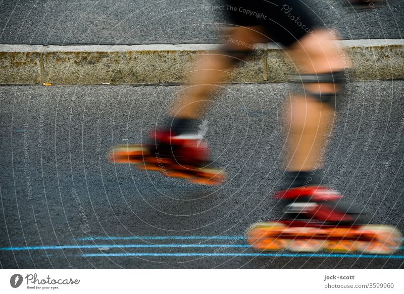 Inline skating between lines on the asphalt Sports Leisure and hobbies Inline skates Curbside Legs motion blur Driving Athletic Knee pads Movement