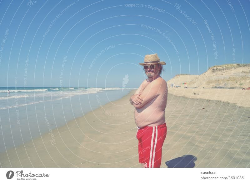 young man on a beach Man vacation Summer Swimming trunks Ocean Atlantic Ocean Sandy beach wide holidays Tourist Holidaymakers Summer vacation Waves