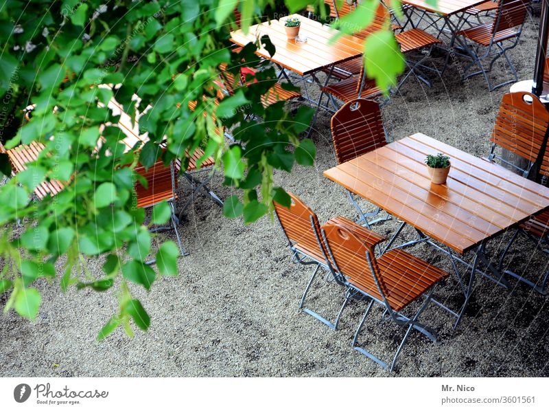 Anticipation I for a beer garden evening without distance rules Going out Table Chair Summer Beer garden Wooden table Café Restaurant Together Regulars Reserved