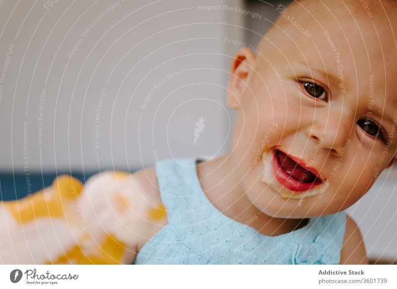 Adorable toddler eating delicious ice cream popsicle dirty mouth child enjoy tasty homemade summer adorable treat terrace rest kid little childhood relax